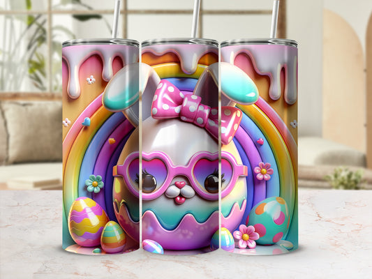 Easter bunny with glasses, bow, and rainbow behind three colorful tumblers.