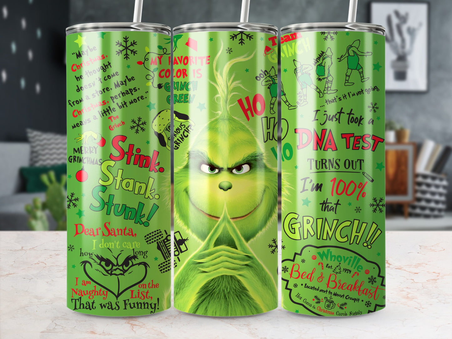 The Grinch themed tumbler with Christmas quotes and cartoon images.