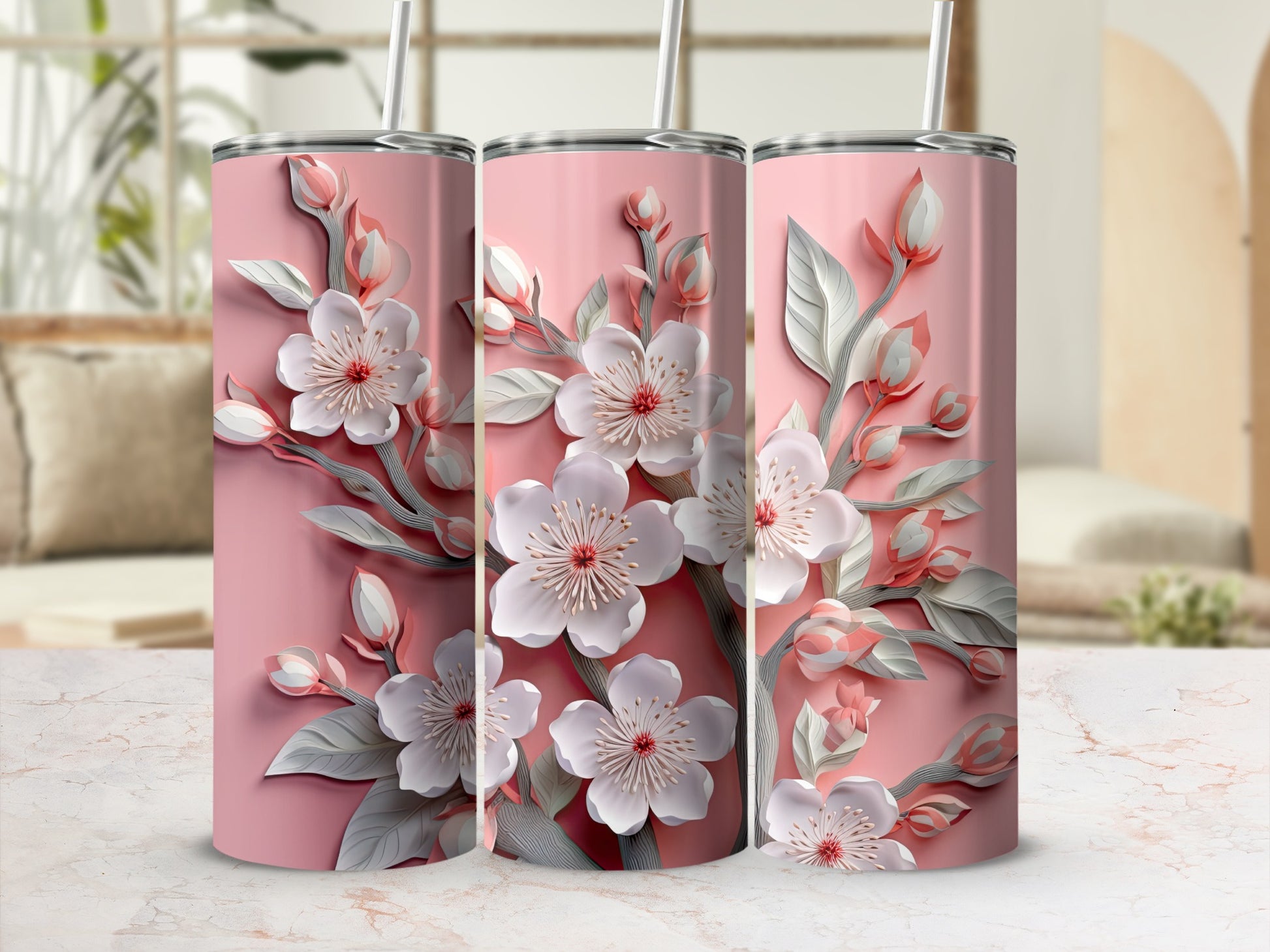 Pink tumbler with delicate white cherry blossoms and green leaves.