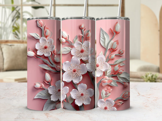 Pink tumbler with delicate white cherry blossoms and green leaves.