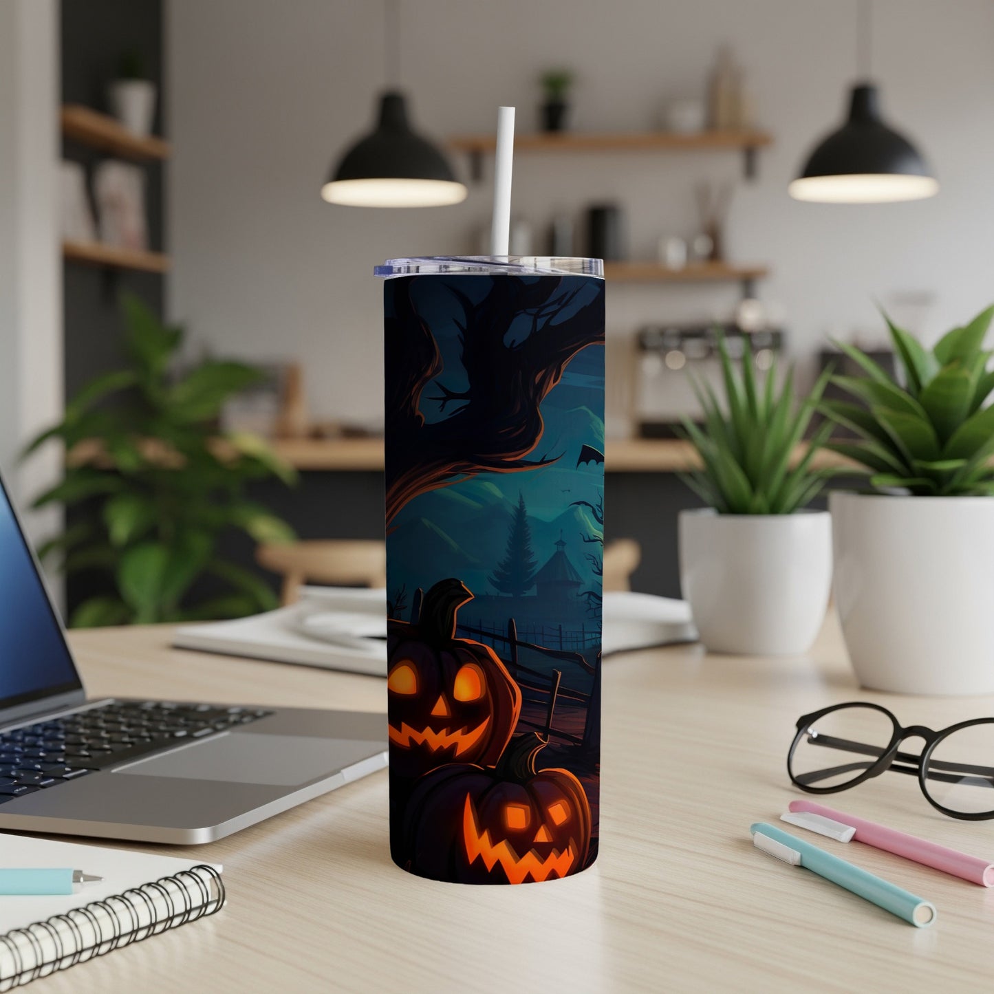 Tumbler with glowing jack-o'-lanterns and a spooky Halloween scene.