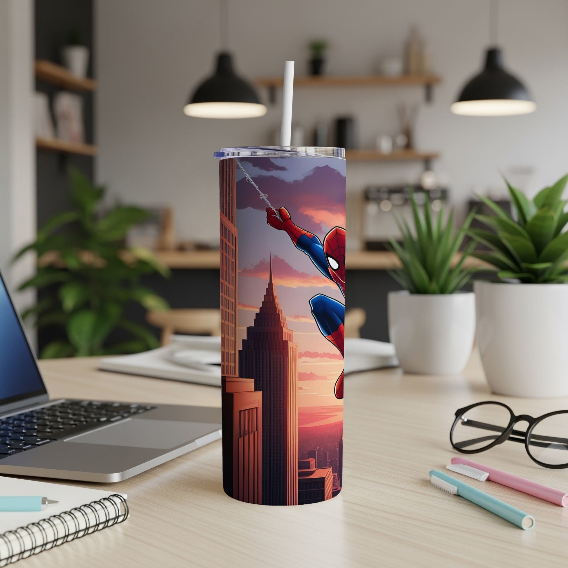 Spider-Man clinging to skyscraper with sunset in background, on a desk.
