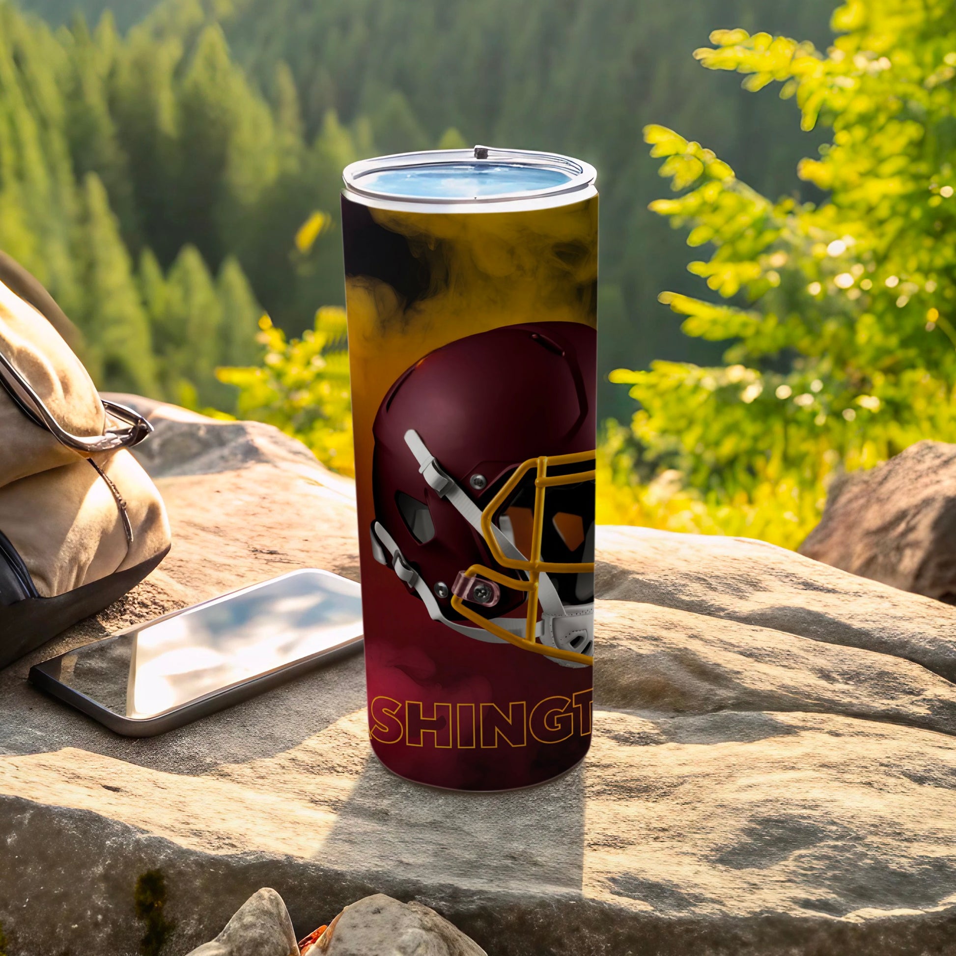 Washington Commanders helmet design on a stainless steel tumbler outdoors.
