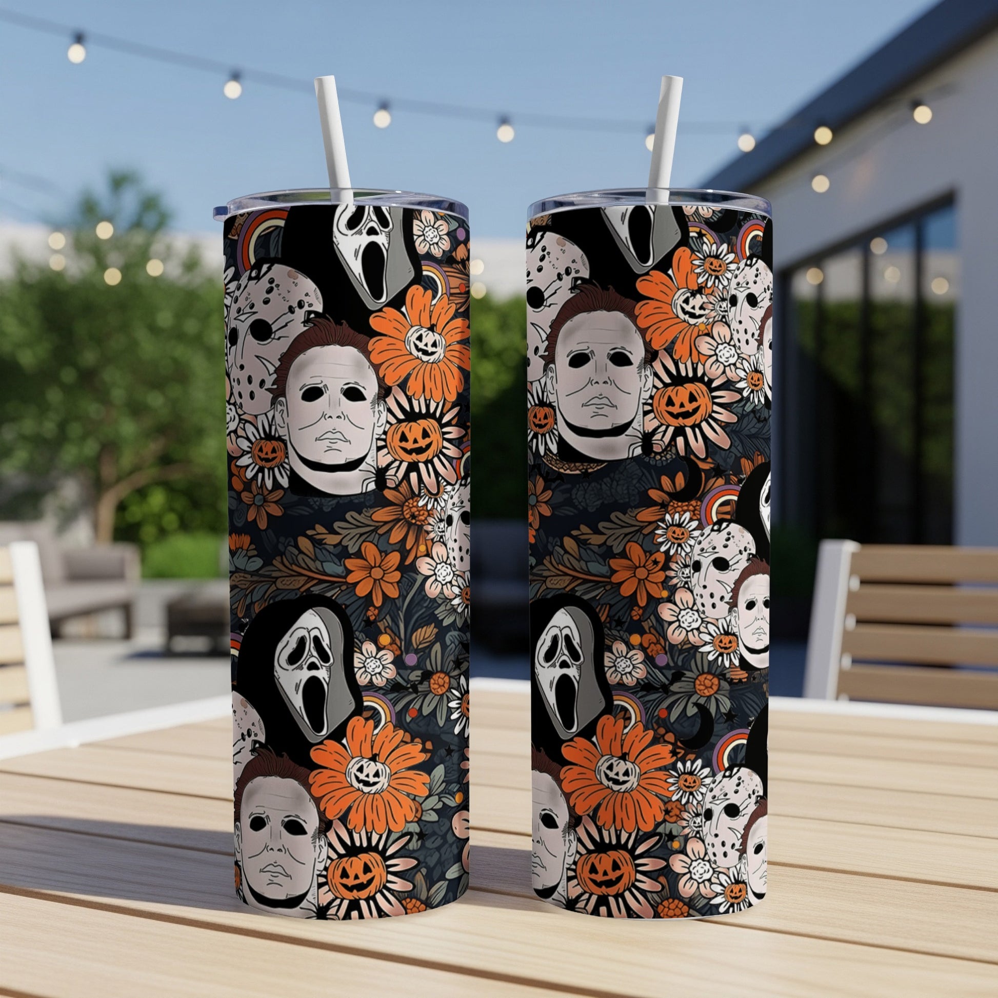 Two tumblers with horror movie characters and floral Halloween pattern.