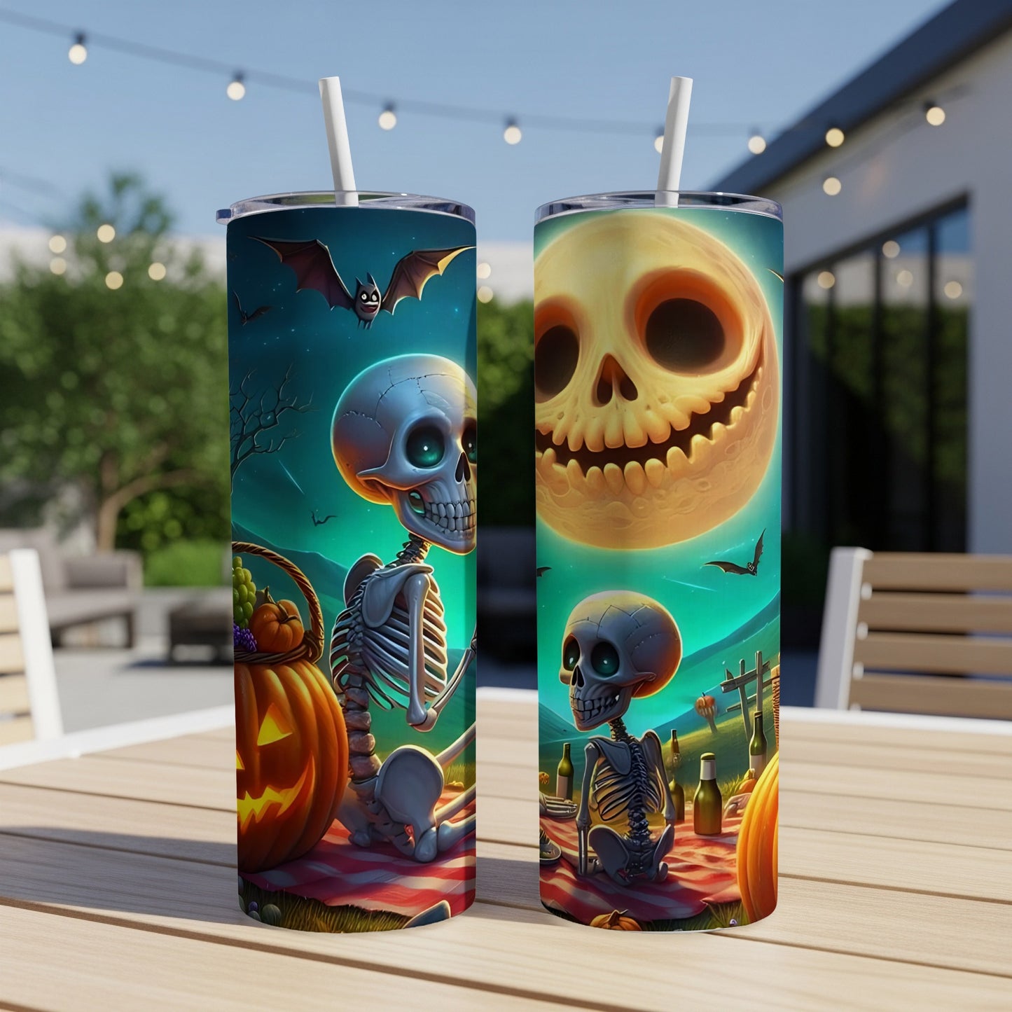 Two Halloween-themed tumblers with skeleton, pumpkin, and bat graphics.