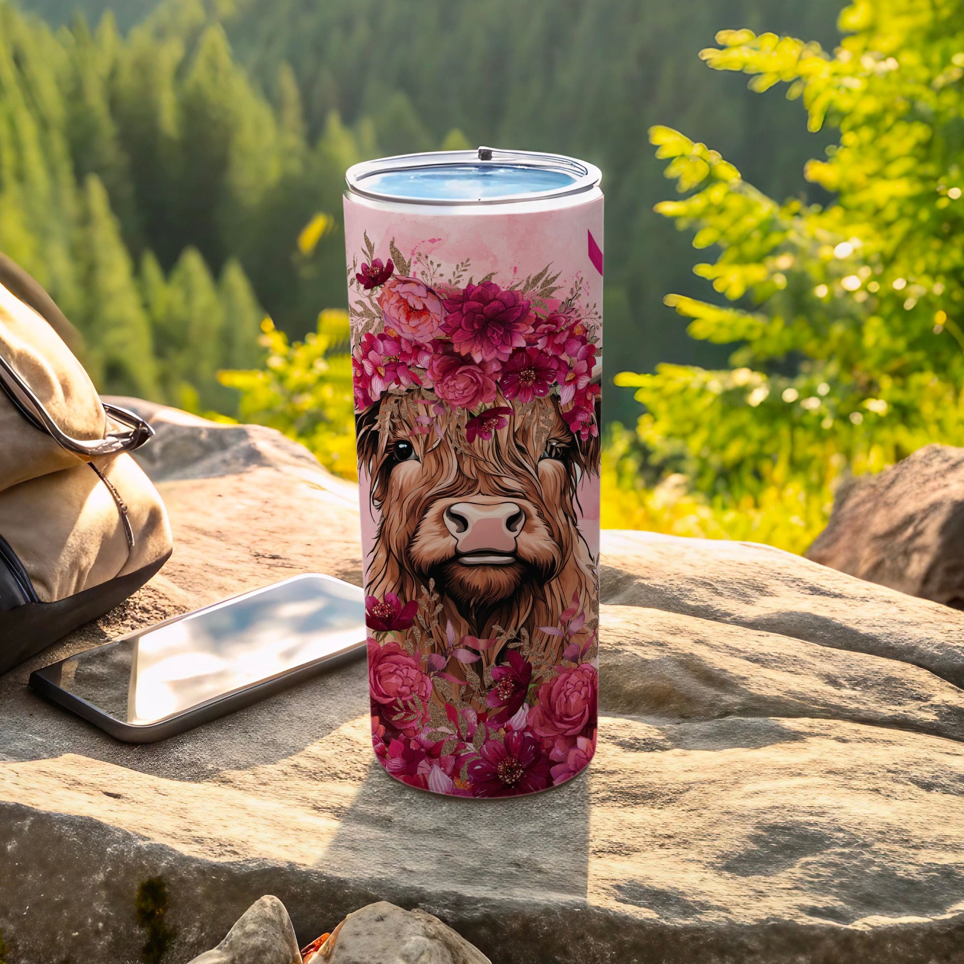 Highland cow with floral wreath on a stainless steel tumbler.
