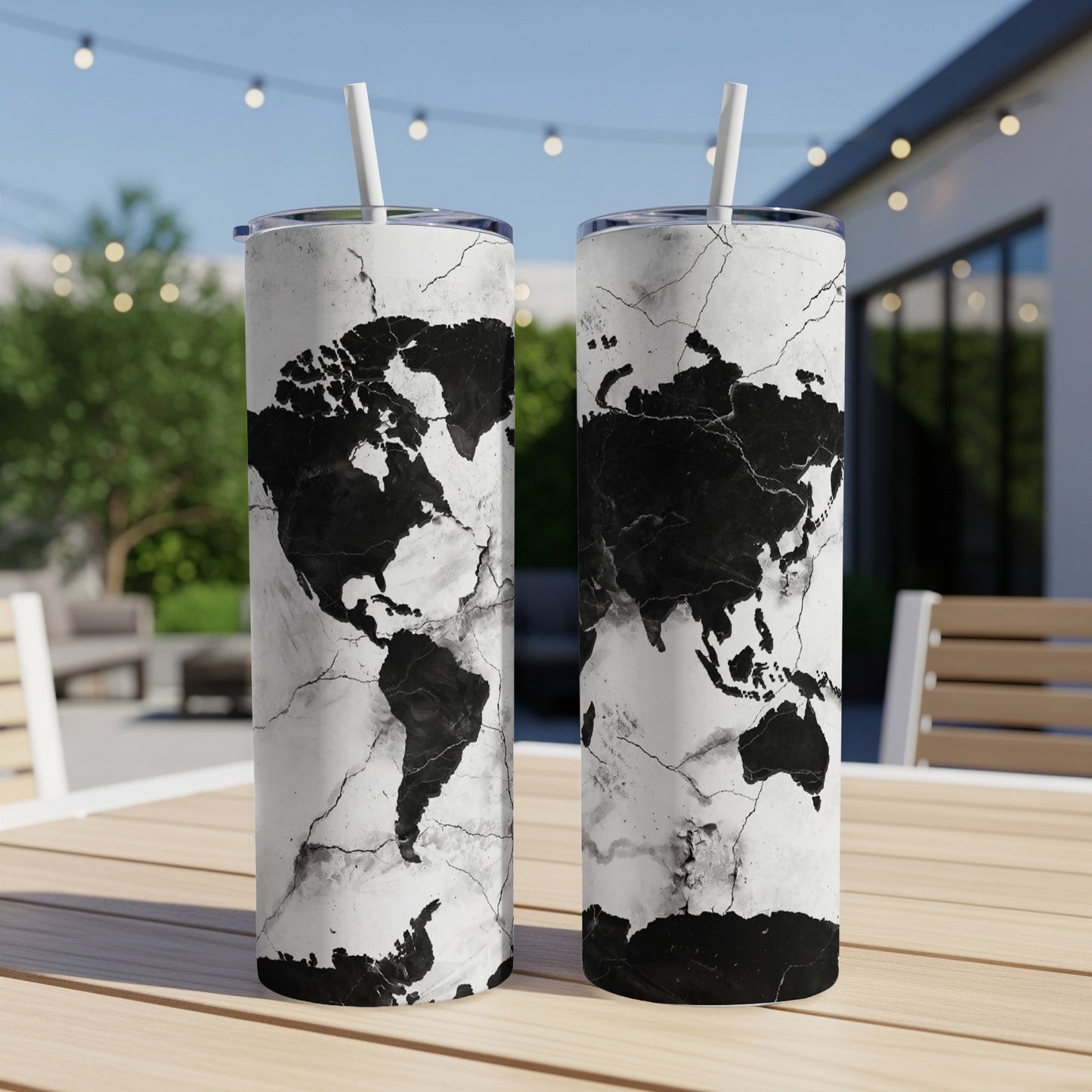 Two tumblers with a black and white distressed world map design.