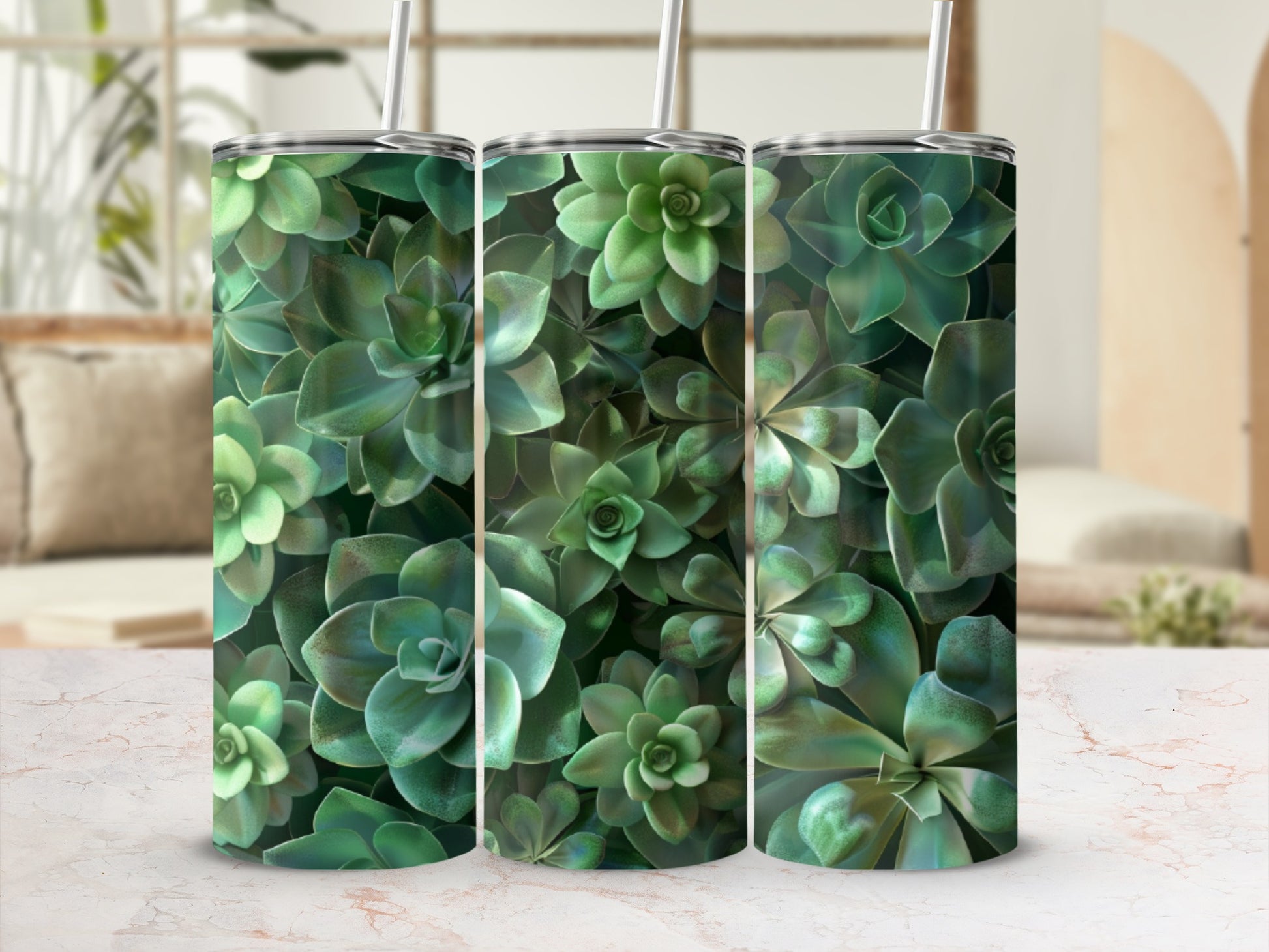 Three green succulent plant tumblers with straws on a counter.