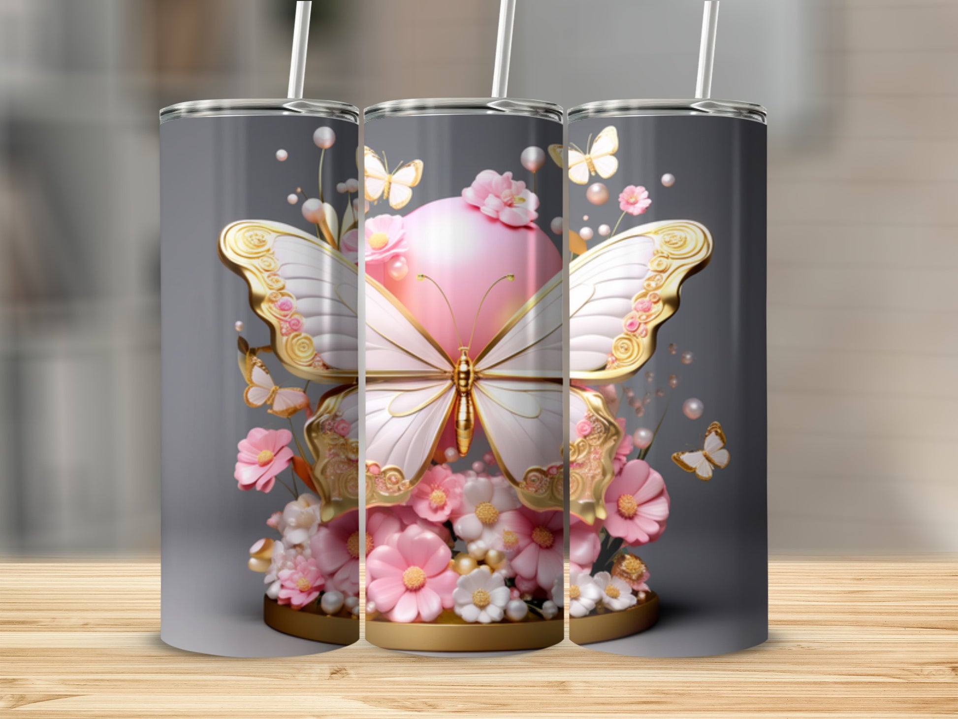 Pink and gold butterfly design on a silver tumbler with floral accents.