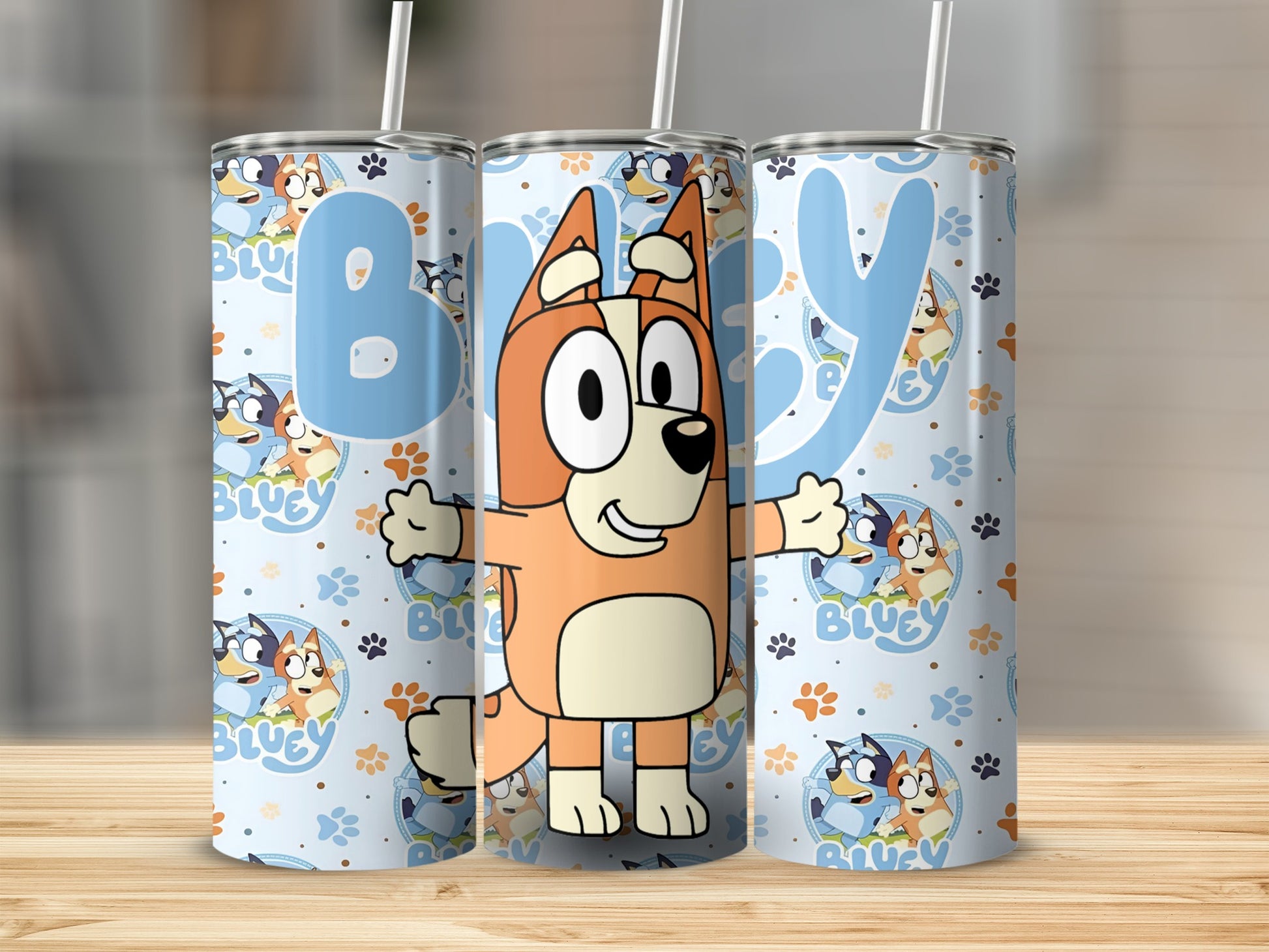 Bluey characters on a light blue patterned tumbler with straw.