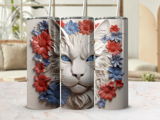 Cat face on tumbler surrounded by red and blue flowers.