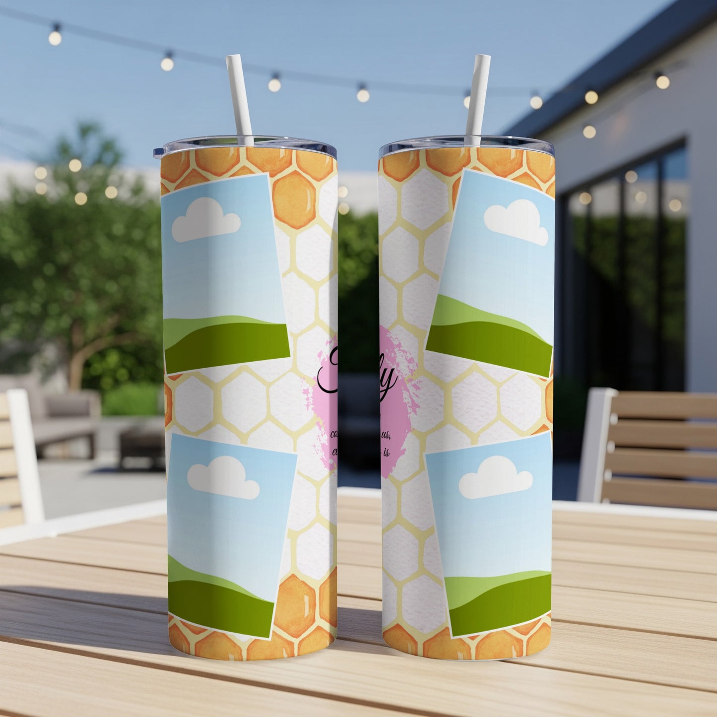 Two tumblers with honeycomb, sky, and green hill designs.