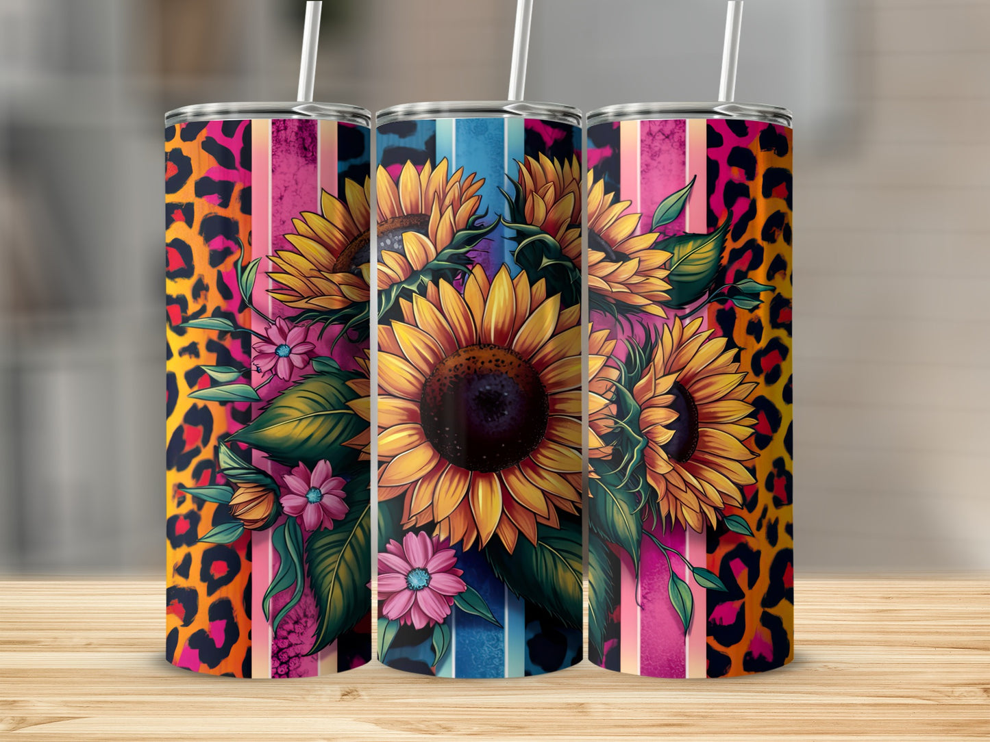 Three tumblers with sunflowers and leopard print designs.