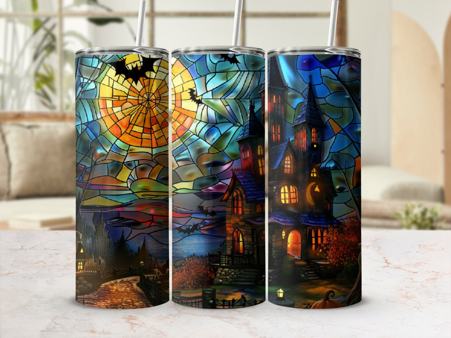 Stained glass tumblers with haunted houses and bats under a full moon.