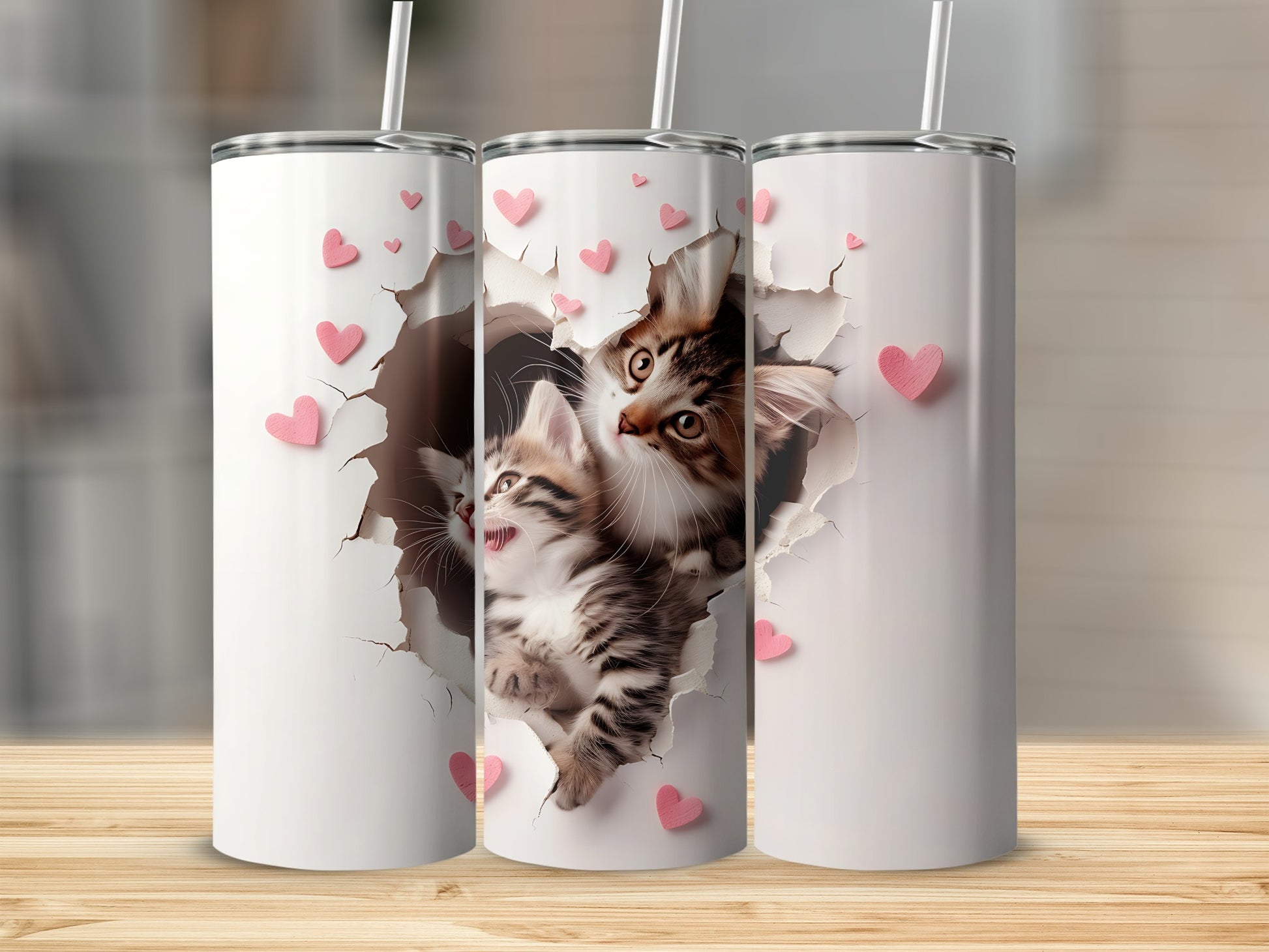 White tumbler with two kittens peeking through ripped paper and pink hearts.