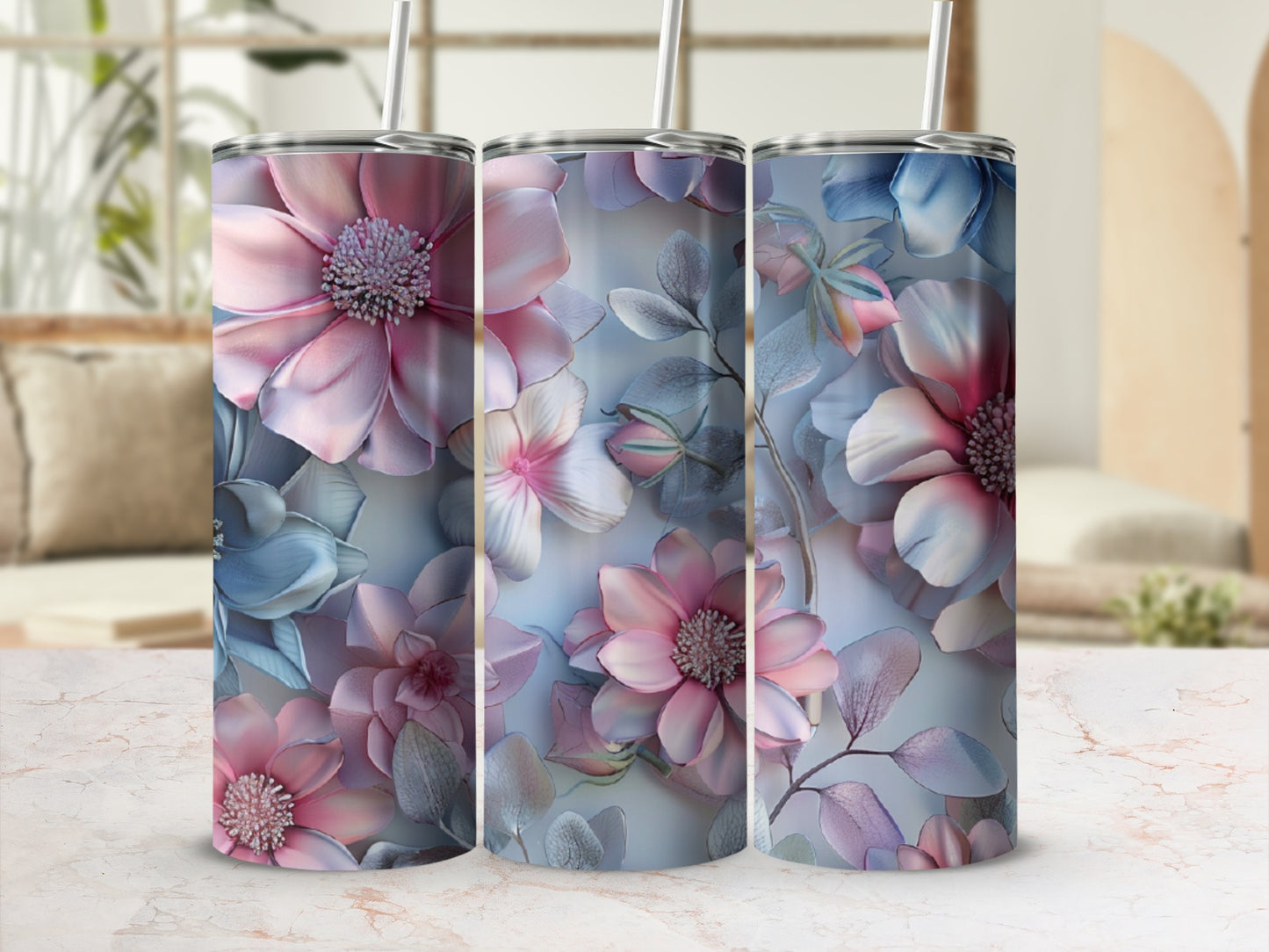 Three tumblers with pink and blue floral patterns.