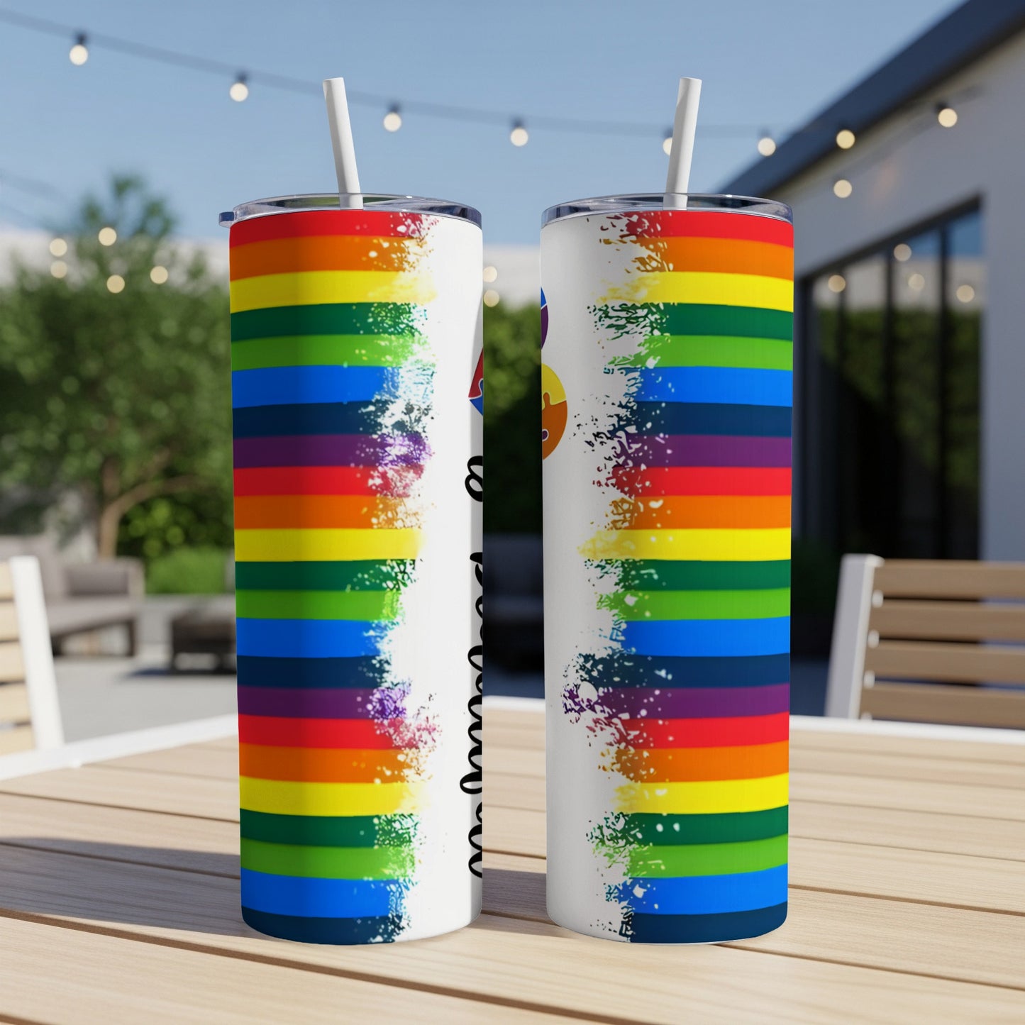 Two tumblers with rainbow stripes and a white splatter design.