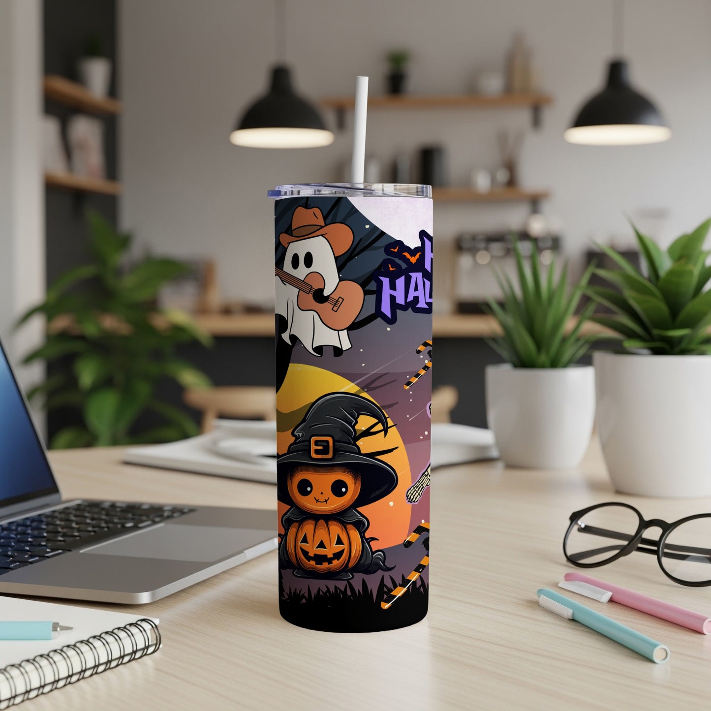 Tumbler with Halloween art: a pumpkin character, a ghost playing guitar, and bats.