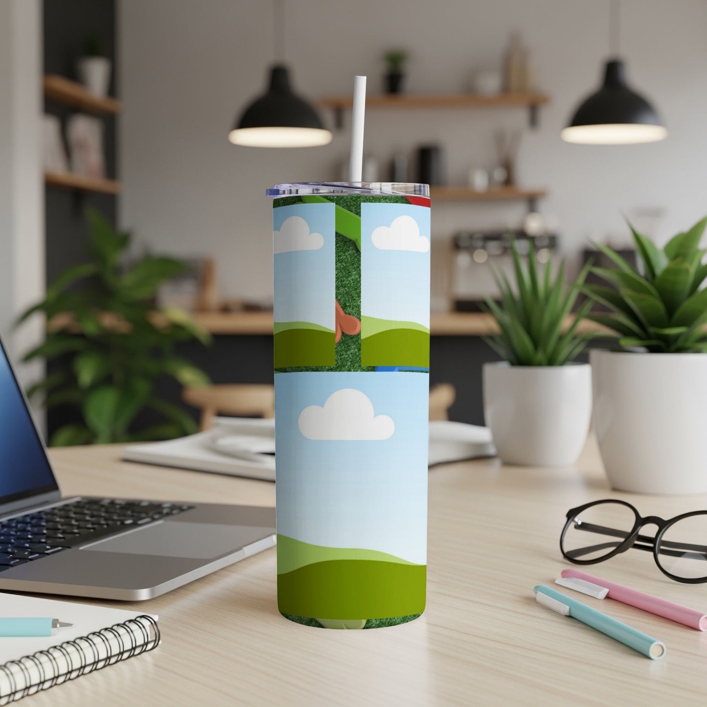 Tumbler with golf course and sky design, featuring a white straw.