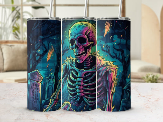Tumblers featuring a colorful skeleton in a spooky graveyard with meteor showers.