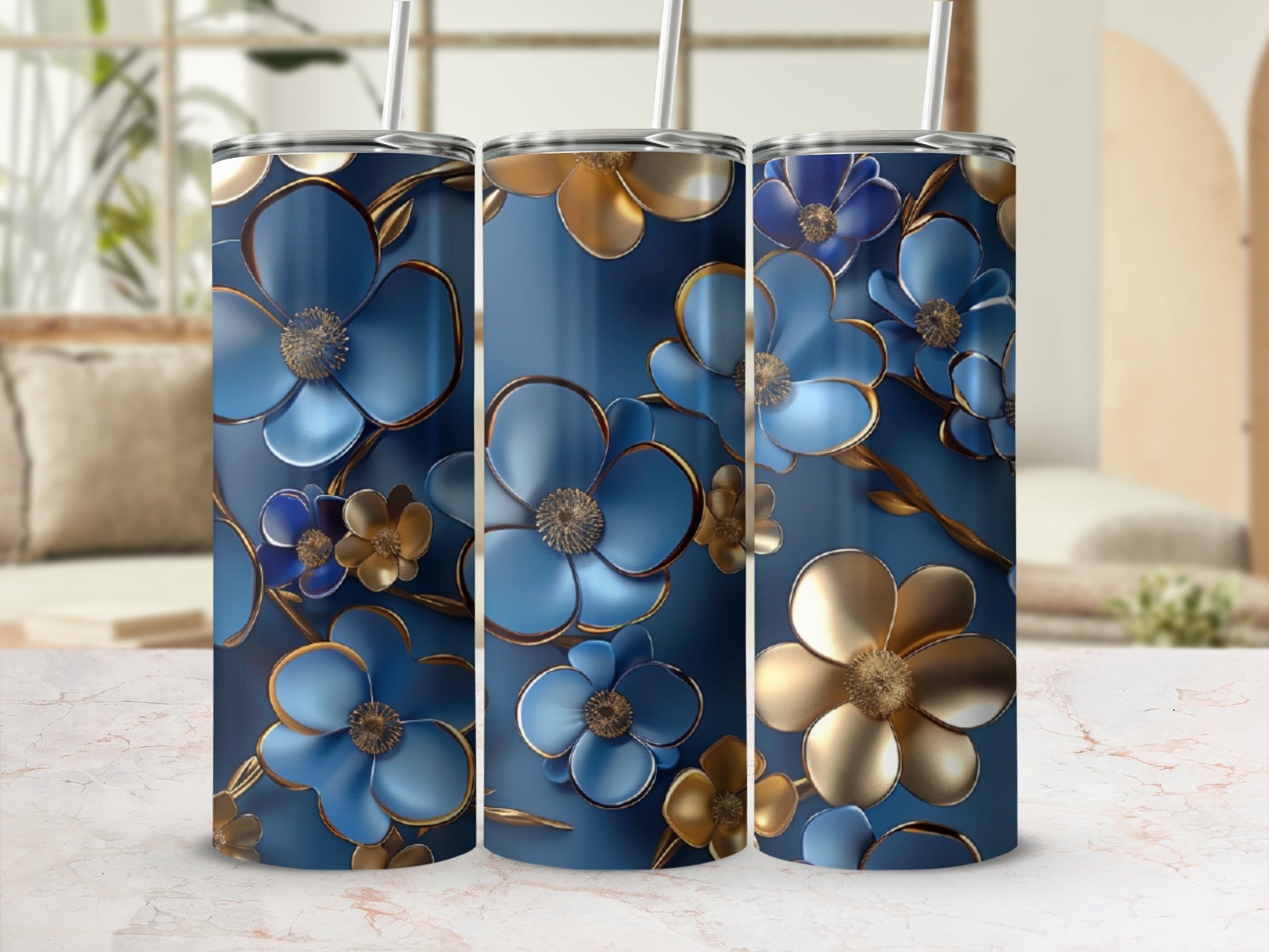Blue and gold metallic floral pattern on three tumblers.