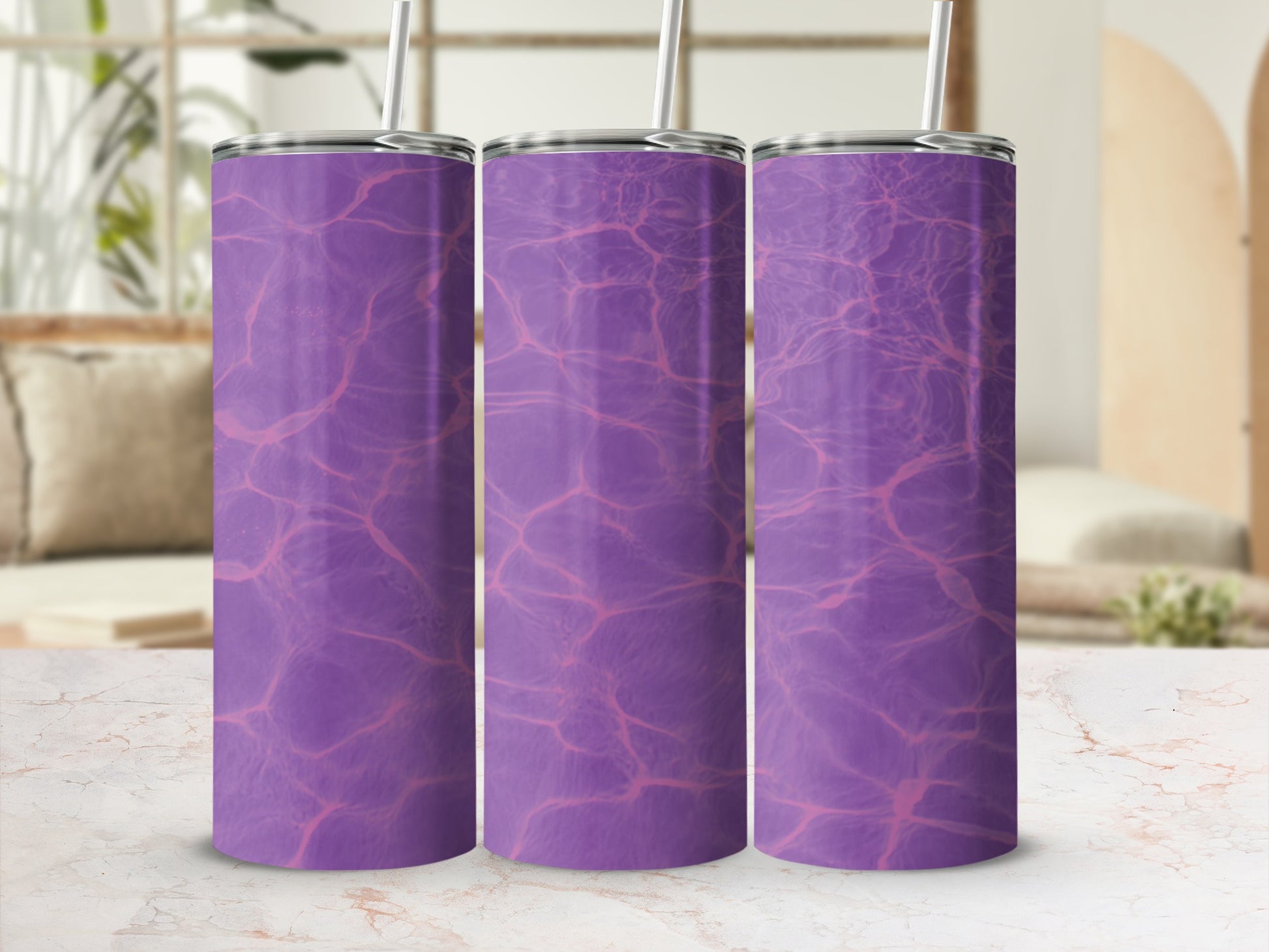 Three tumblers with a purple water ripple pattern and straws.