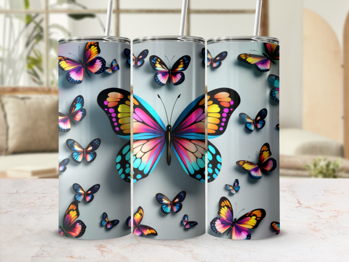 Tumbler with colorful butterfly pattern and straw.