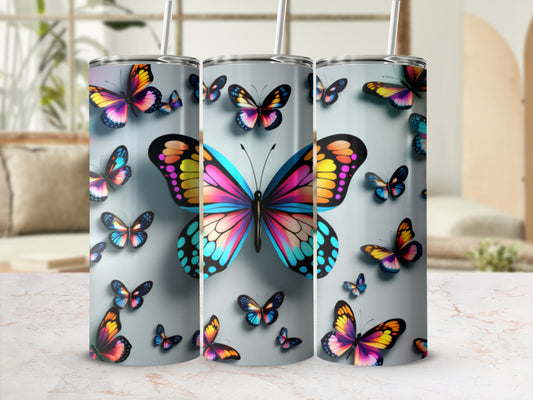 Tumbler with colorful butterfly pattern and straw.