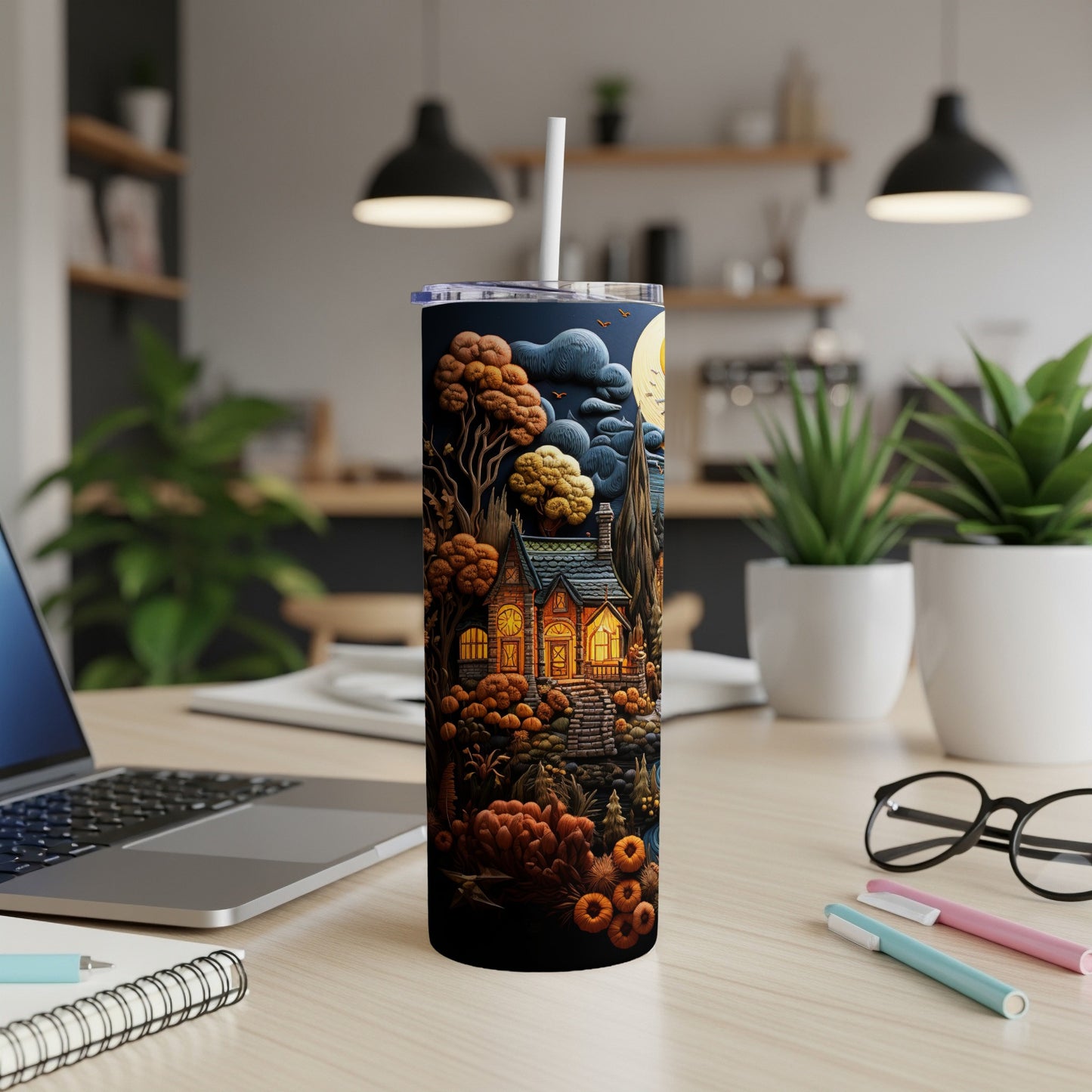 Tall tumbler with a Halloween-themed illustration of a spooky house and pumpkins.