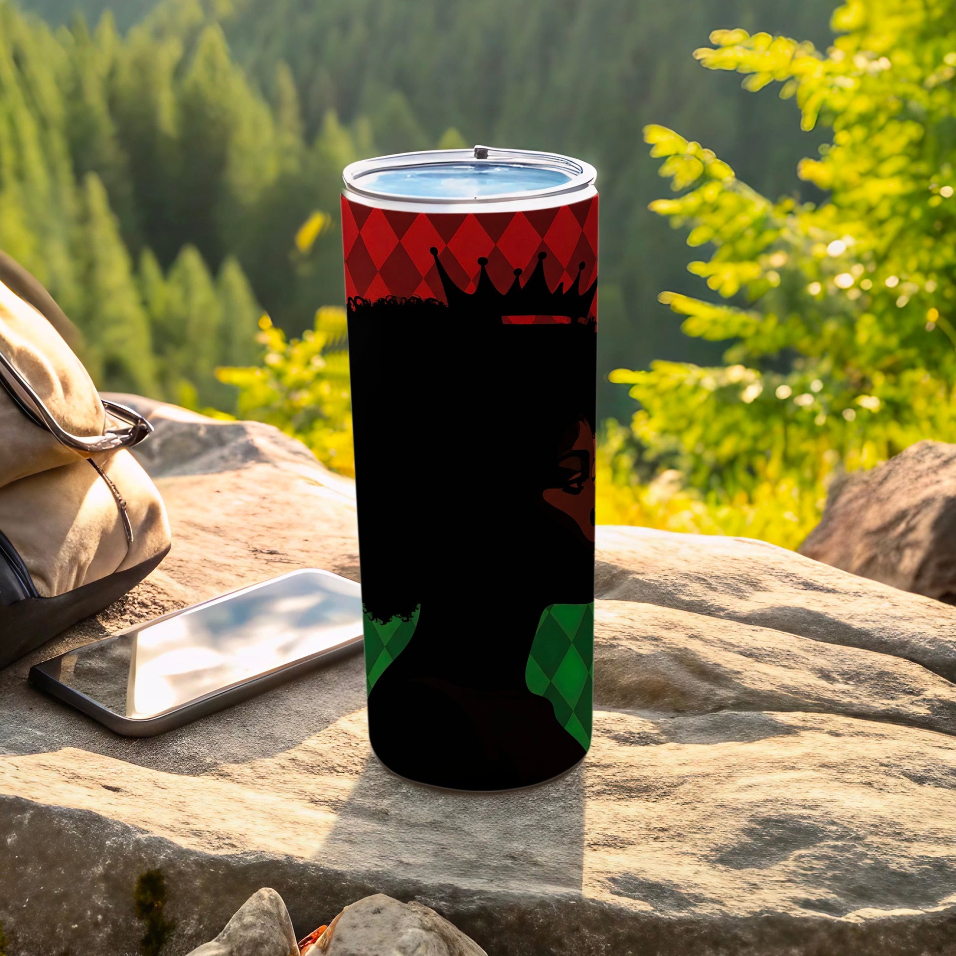 Black tumbler with crown silhouette and red and green diamond pattern.
