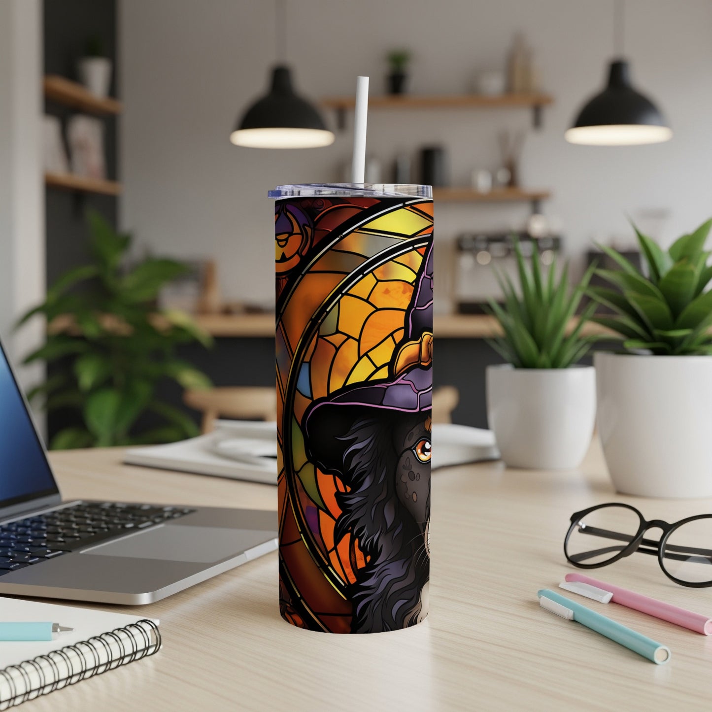 Black dog in witch hat, stained glass design on a tumbler.
