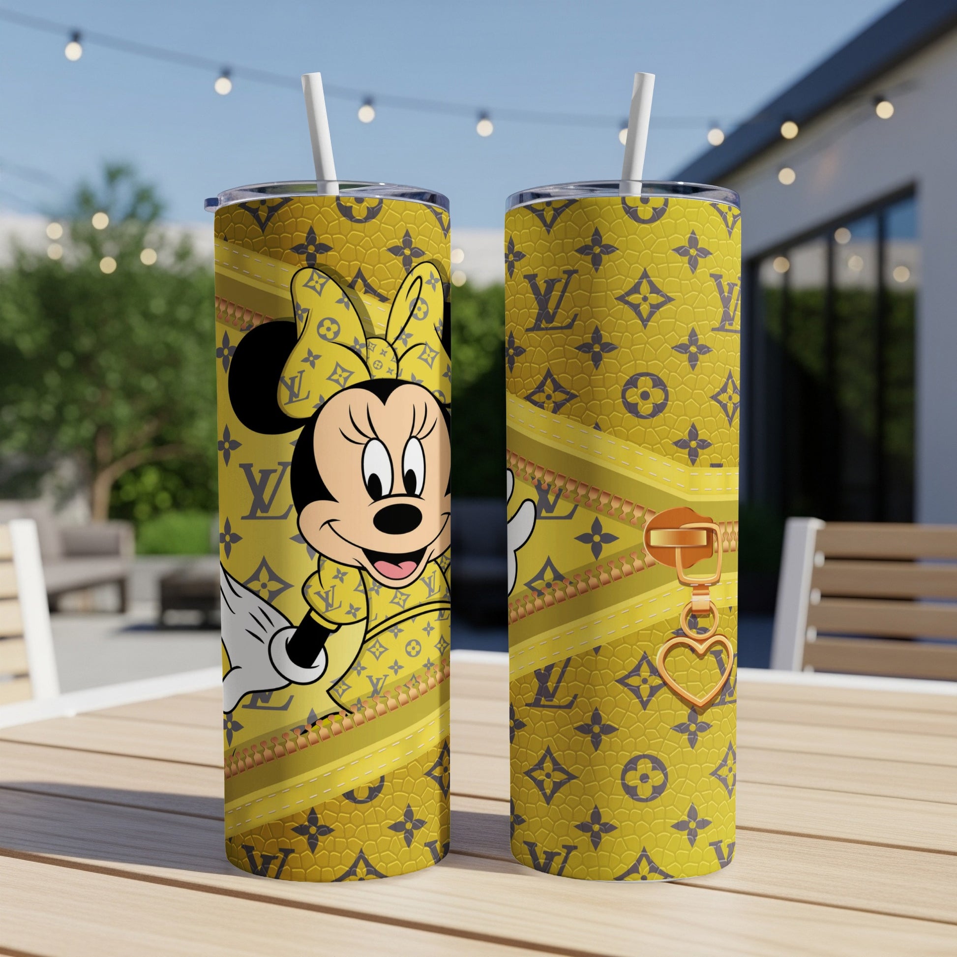 Yellow tumbler with Minnie Mouse and LV pattern, gold zipper and heart charm.
