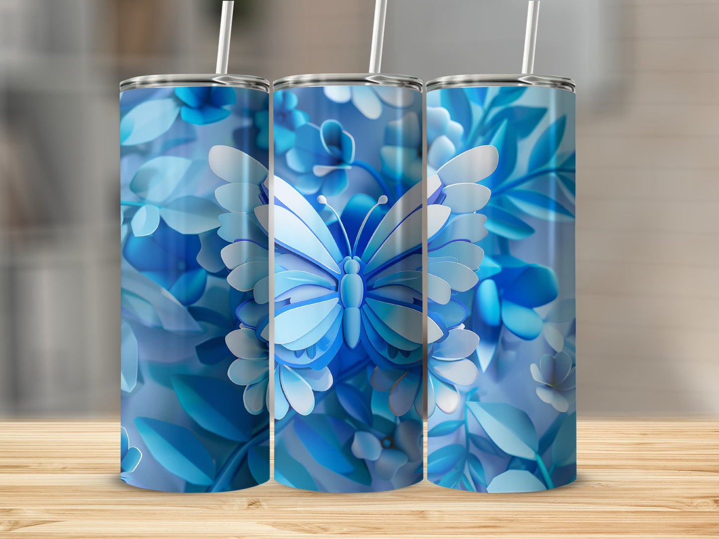 Three tumblers with blue butterfly and floral pattern.