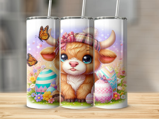 Cute Highland cow with Easter eggs and butterflies.