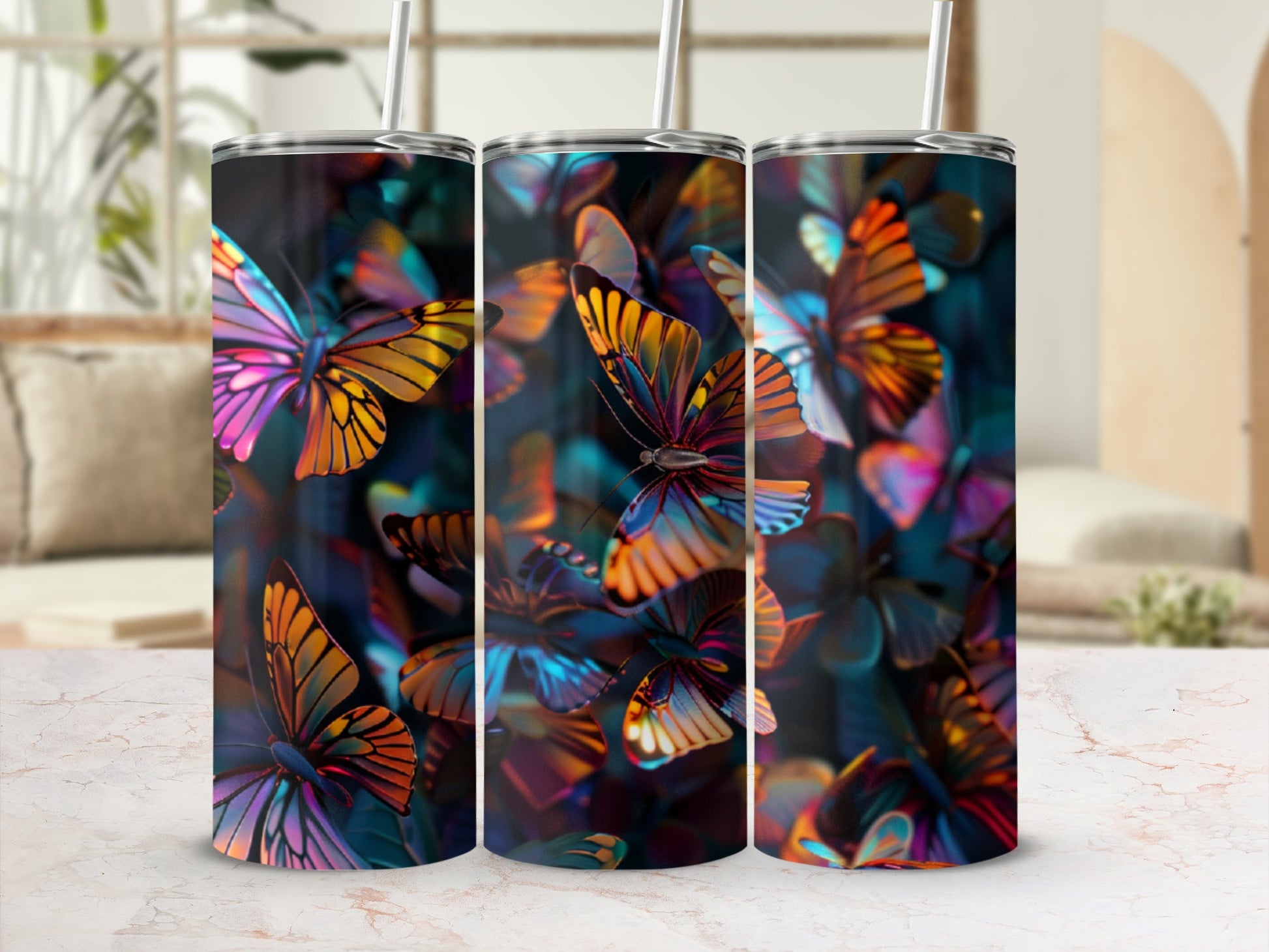 Three tumblers with a colorful butterfly design.