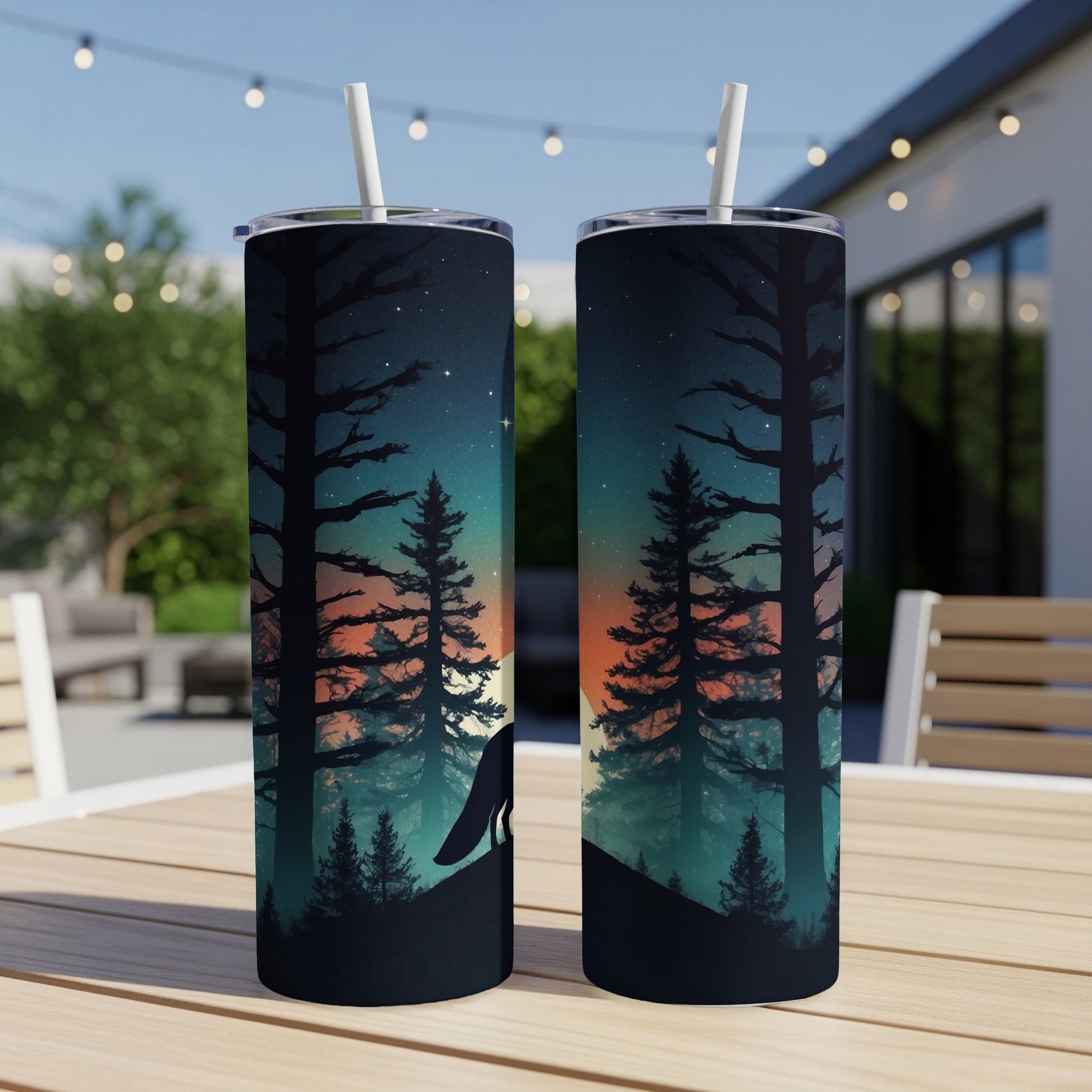 Two tumblers displaying a wolf silhouette against a starry night sky and trees.