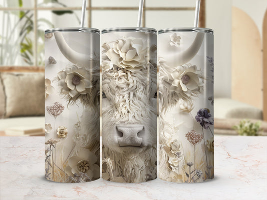 White highland cow with floral accents on a tumbler.