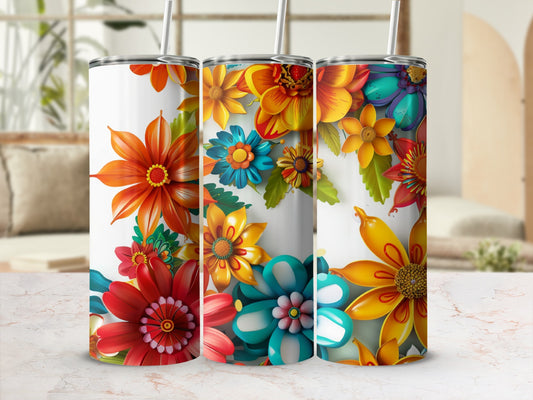 Three tumblers with vibrant floral patterns in shades of red, orange, yellow, and teal.