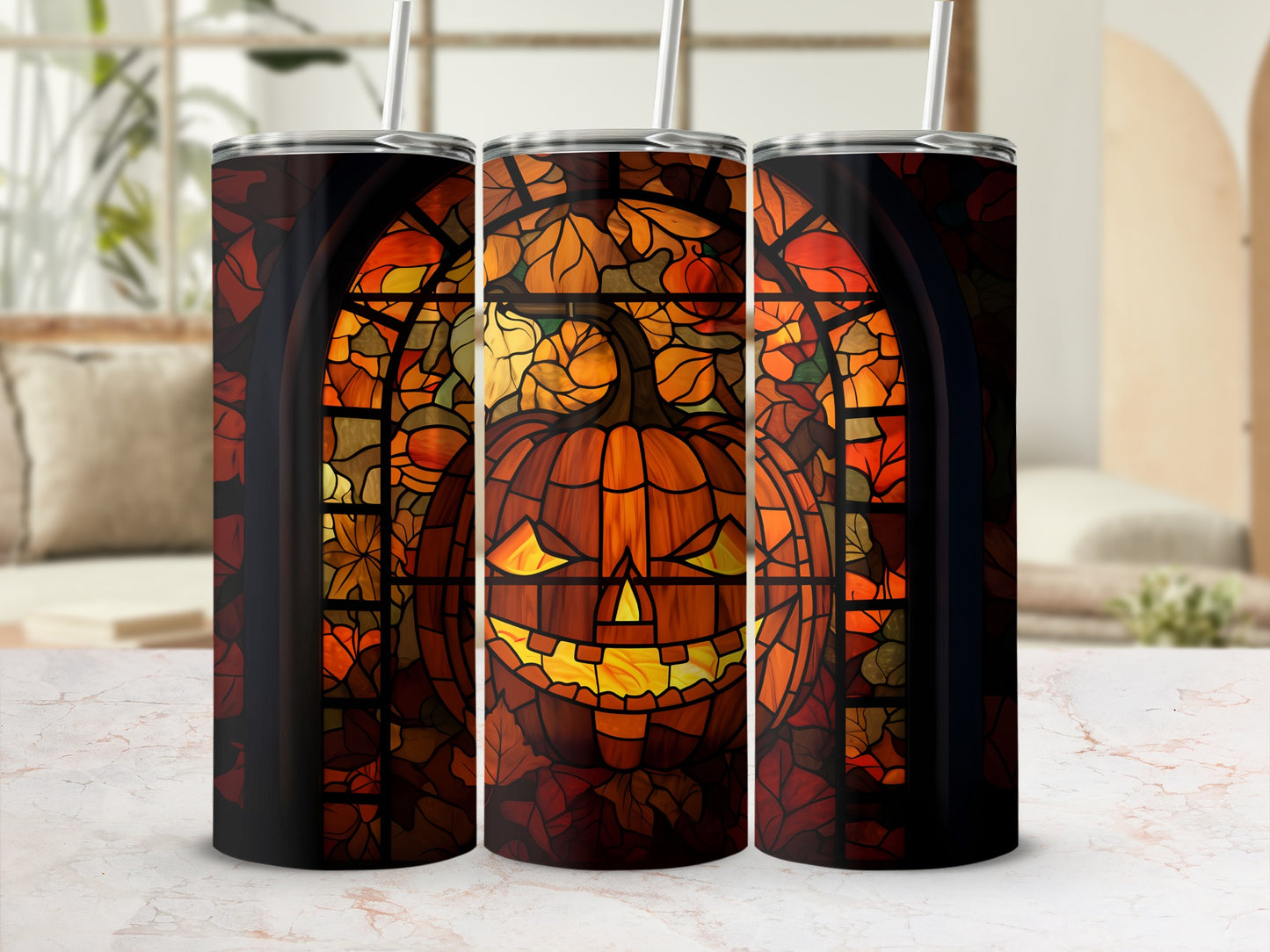 Triptych of tumblers featuring a stained glass pumpkin on an autumn leaf background.