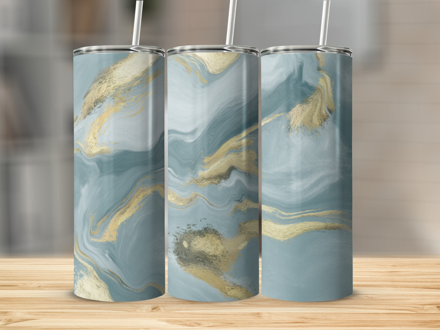 Three tumblers with blue and gold marbled abstract design.