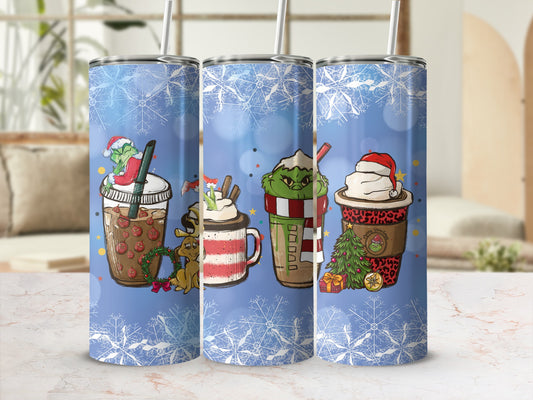 Three Grinch-themed insulated tumblers with holiday designs and snowflakes.