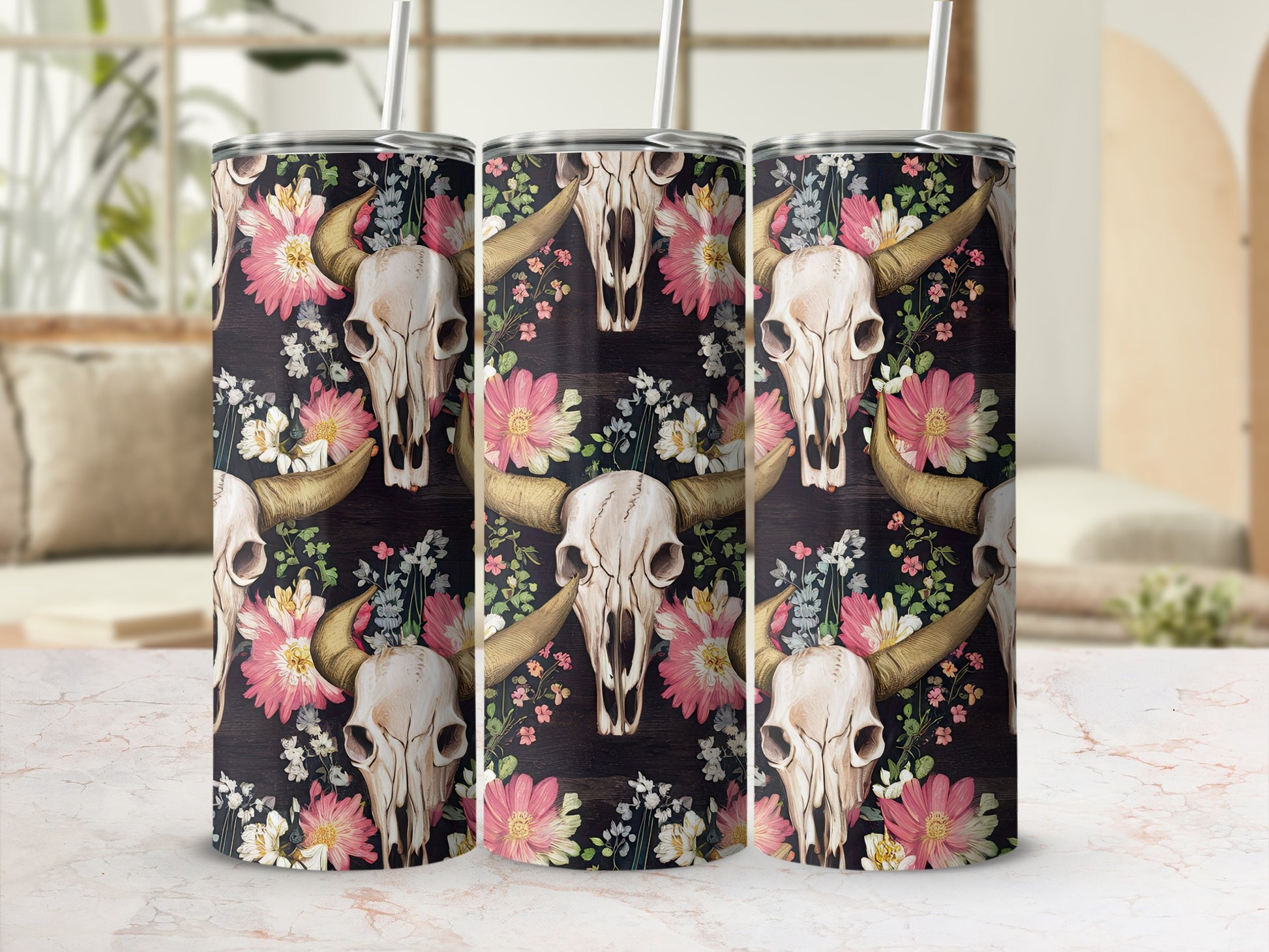Cow skull and floral pattern on three tumblers.