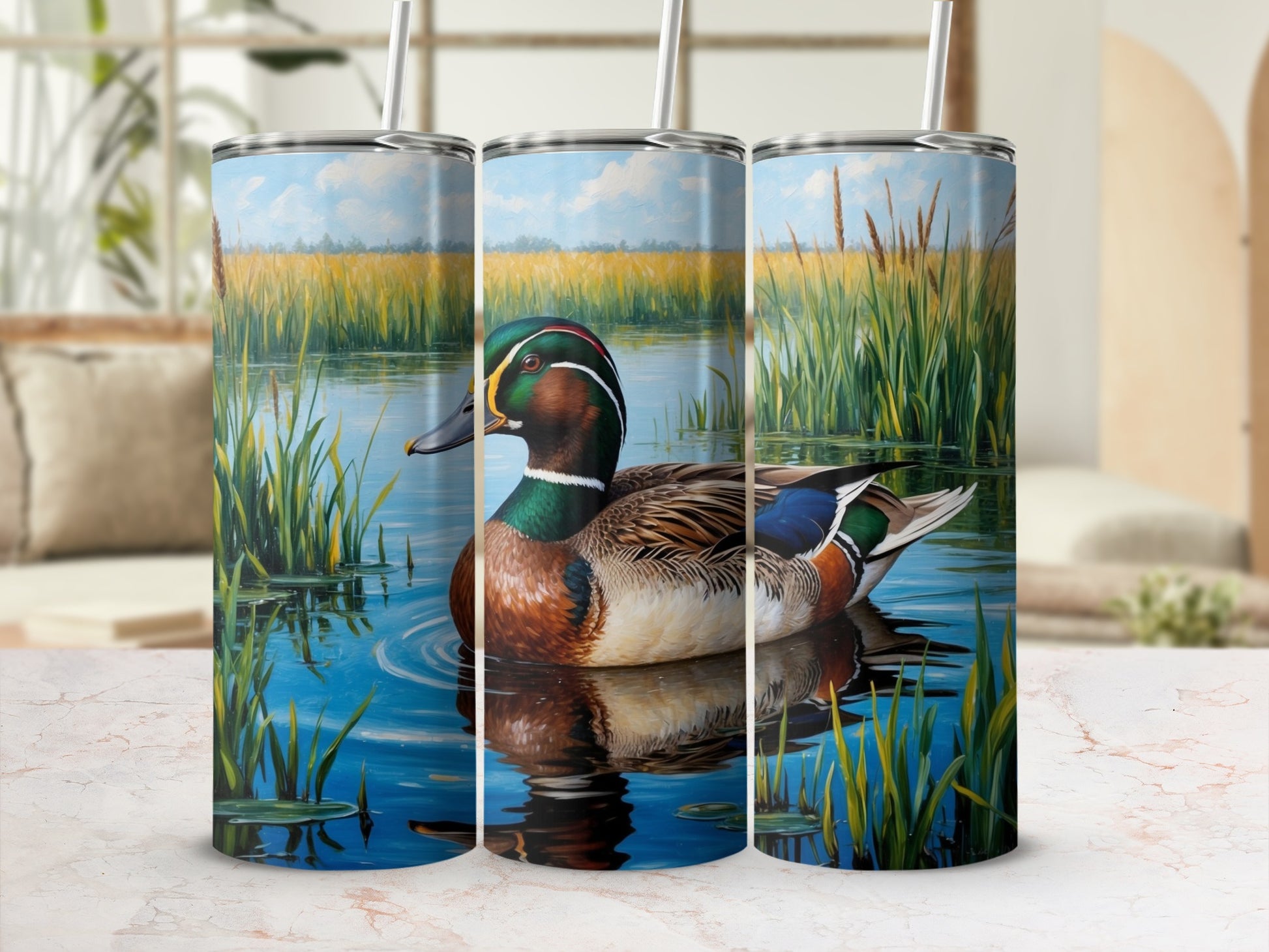 Mallard duck on water, with reeds and sky, displayed on a tumbler.