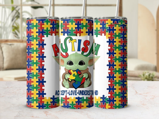 Grogu from Star Wars holding puzzle pieces with "Autism Accept-Love-Understand" text.