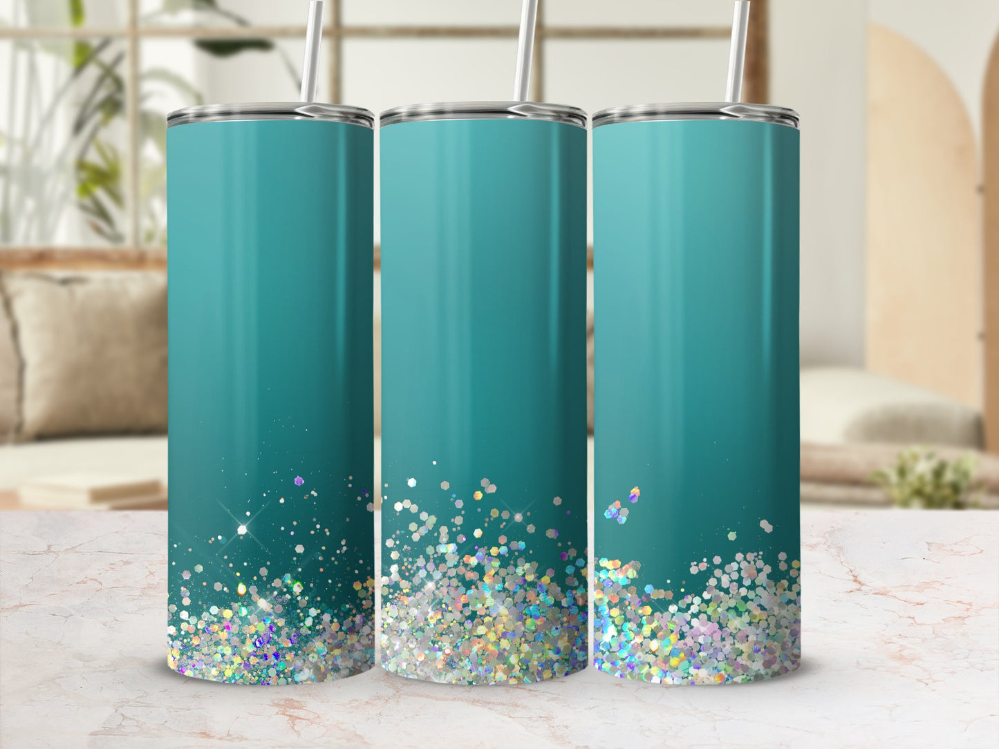 Three aqua tumblers with glitter accents and silver lids and straws.