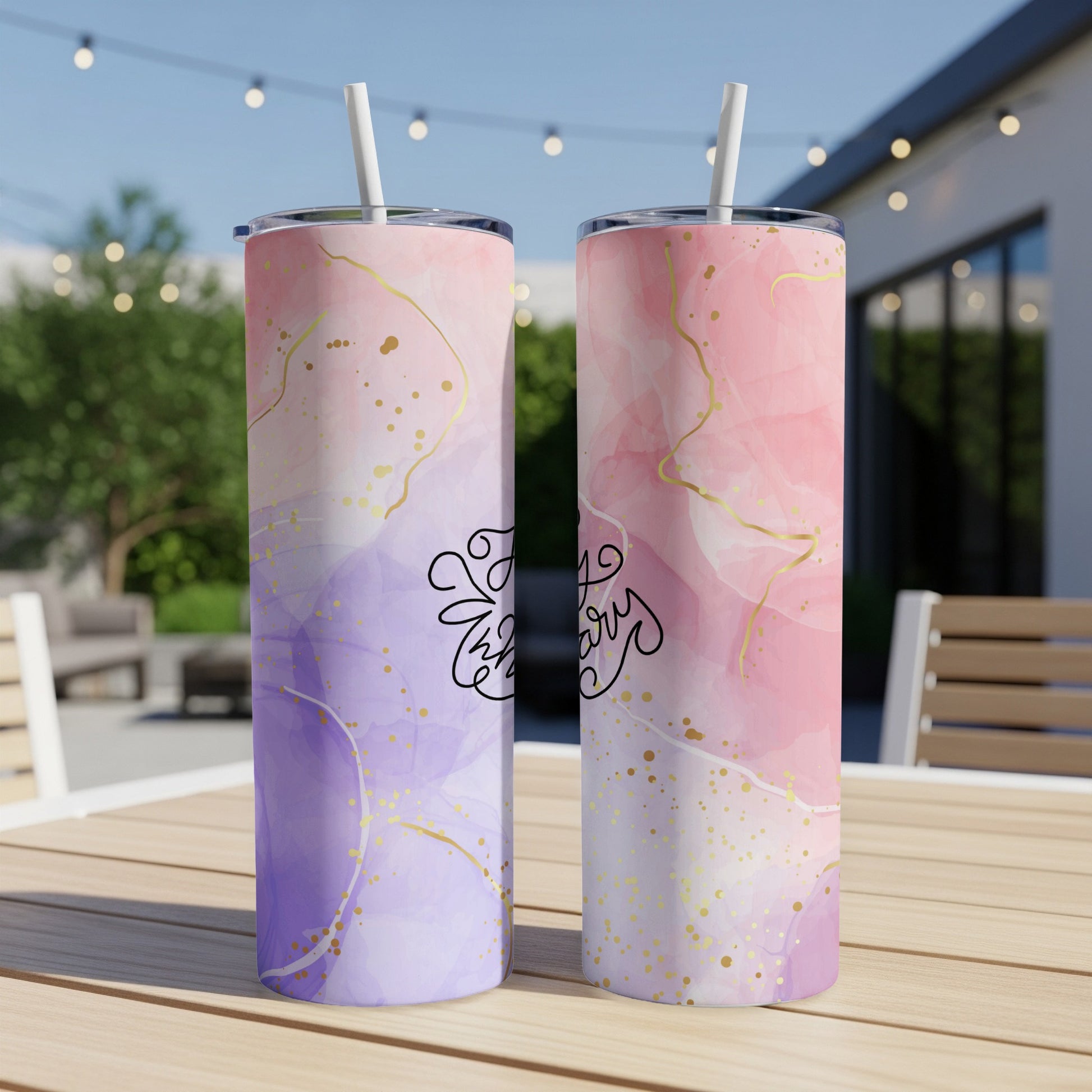 Two tumblers with marble-like purple and pink watercolor designs and gold splatters.