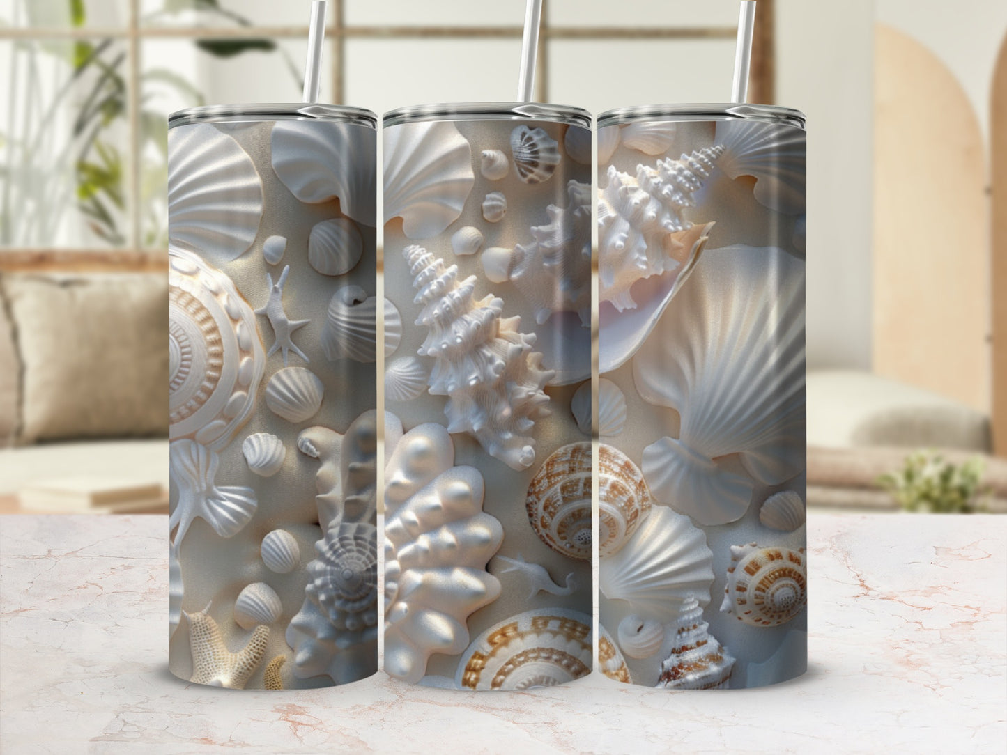 Three white tumblers with seashell and coral designs.