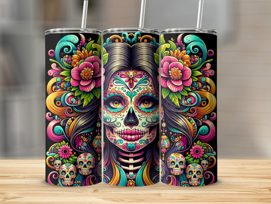 Three tall tumblers featuring colorful Day of the Dead skull designs with flowers.