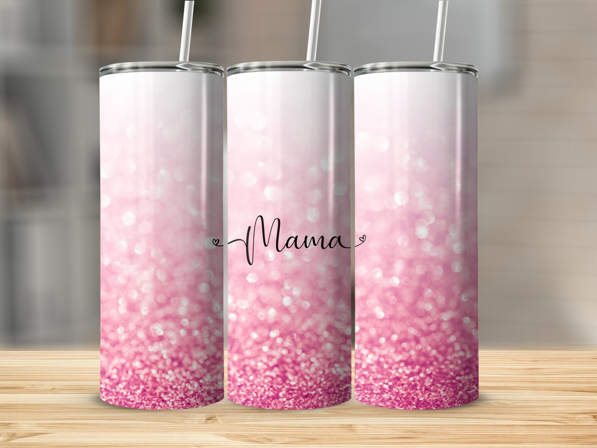 Pink glitter tumbler with "Mama" text and a straw.