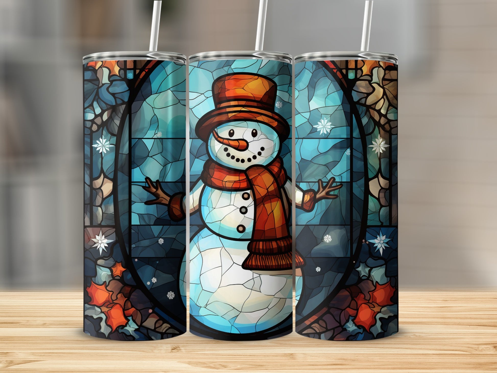 Stained glass snowman tumbler with straw on wooden surface.